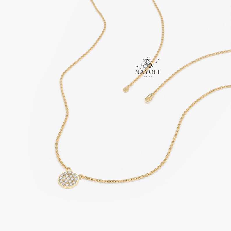 Elegant pave diamond circle necklace in yellow gold minimalist style.
