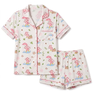 May include: A short-sleeve button-down pajama shirt and matching shorts set in off-white, featuring a repeating pattern of pink monkeys holding umbrellas, standing in blue puddles, with small watering cans, wooden crates, and green leaves.