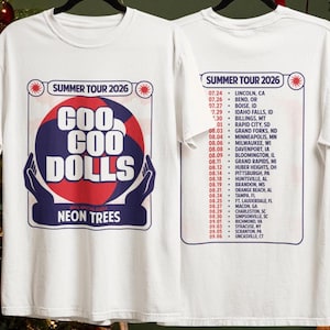May include: A white t-shirt featuring a graphic for the Goo Goo Dolls Summer Tour 2026 with Neon Trees. The front displays a red and blue circular design held by hands, while the back lists tour dates and locations in red and blue text.