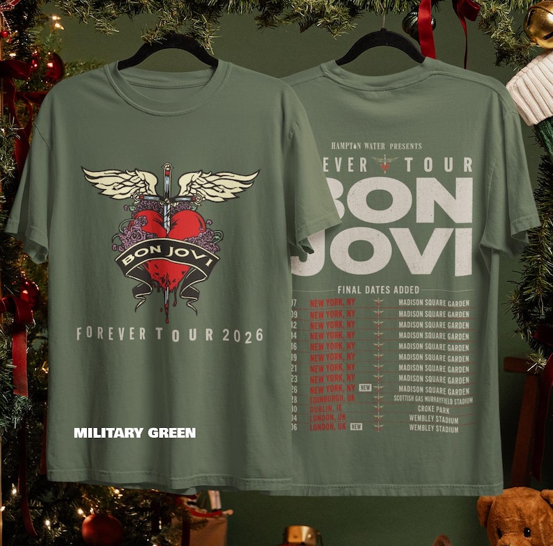 May include: A military green t-shirt featuring a Bon Jovi Forever Tour 2026 graphic on the front with a winged heart and sword. The back displays the tour name, Hampton Water presents, and a list of final tour dates in New York and Europe.