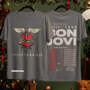 May include: A charcoal gray t-shirt featuring a front graphic of a red heart pierced by a sword with wings and the text Bon Jovi Forever Tour 2026. The back displays the Hampton Water Presents Forever Tour Bon Jovi text with a list of final dates.