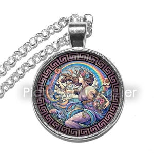 May include: A silver chain necklace with a round glass pendant featuring a colourful illustration of a woman with flowers in her hair, holding a flower-filled bowl, standing in front of a rainbow. The pendant is surrounded by a silver Greek key border.