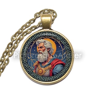 May include: A round pendant necklace with a detailed illustration of a bearded man in a red and blue robe, set against a starry night sky. The pendant has a gold-colored frame and chain.