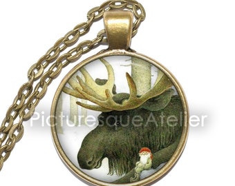 May include: A round glass pendant necklace with a bronze chain. The pendant features a vintage illustration of a moose with large antlers and a small gnome sitting on a branch.