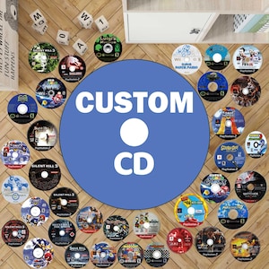 May include: A selection of video game CDs, featuring games such as "Silent Hill 3," "Sonic Heroes," and "Super Paper Mario." The discs are displayed around a large blue circle with the text "CUSTOM CD".