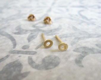 Tiny gold circle stud earrings , asymmetric gold post earrings , small everyday studs