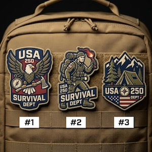May include: Three embroidered patches with a survival theme. The patches feature an eagle, a soldier, and a campsite design, all with the text "USA 250 SURVIVAL DEPT". The patches are in shades of blue, red, and tan.