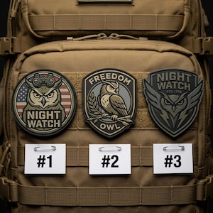 May include: Three embroidered patches with owl designs are displayed on a tan backpack. The patches feature the words "NIGHT WATCH" and "FREEDOM OWL". One patch has an American flag design. Each patch is labeled with a number.