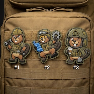 May include: Three embroidered patches featuring cartoon beavers in work attire. The beavers wear helmets and vests, holding tools like wrenches, blueprints, a gear, a shovel, and a coffee cup. Each patch is numbered #1, #2, and #3.
