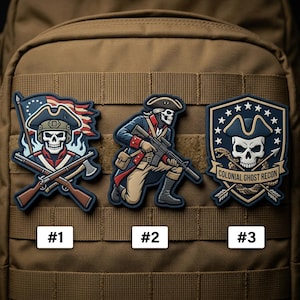 May include: Three patches featuring skull designs in colonial attire. One patch shows a skull with a flag and crossed rifles. Another depicts a skull soldier kneeling with a rifle. The third patch has a skull with a snake and the text "COLONIAL GHOST RECON".