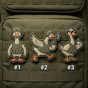 May include: Three cartoon patches featuring geese in military gear. One goose wears a helmet and vest, another holds a grenade, and the third wears sunglasses and holds a coffee cup. Each patch is numbered.