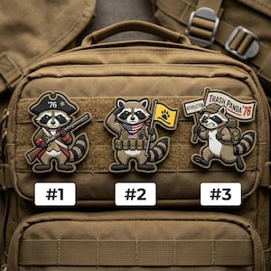 May include: Three embroidered patches featuring raccoon characters. One raccoon wears a tricorn hat and holds a rifle, another salutes with an American flag, and the third carries a sign that says "Trash Panda '76".