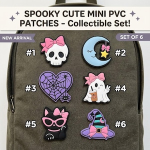 May include: A set of six PVC patches featuring spooky designs including a skull with a pink bow, a crescent moon with a star, a spiderweb heart, a ghost holding a drink, a black cat with pink glasses, and a striped witch hat with a pink bow.
