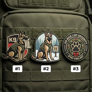 May include: Three tactical morale patches featuring German Shepherd dogs. Patch 1 shows a K9 with a scroll labeled NICE LIST. Patch 2 shows a K9 by a sign reading NICE LIST K9 SECURITY. Patch 3 is a circular badge with a paw print and K9 NICE LIST SECURITY.
