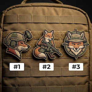 May include: Three tactical patches featuring fox illustrations. One fox wears a helmet, another holds a rifle, and the third wears a hat. Each patch is a different design, with the numbers #1, #2, and #3 below each.