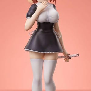 May include: A figurine of a female anime character in a black and white maid outfit, with a sword. The character has blonde hair, cat ears, and an eye patch. She is wearing white stockings and black shoes with bows. The background is a solid peach color.