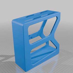 May include: A bright blue, rectangular, open-frame storage organizer featuring a solid top surface with two elongated slots and a hollow interior structure with a single horizontal support bar, designed with a geometric, angular side profile.