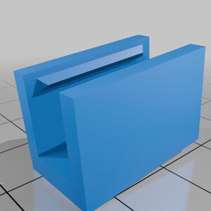 May include: A bright blue U-shaped channel component with a rectangular profile and a smooth matte finish. The object features a central open cavity with a beveled inner edge along the top rim, presented in a clean, three-dimensional digital render.