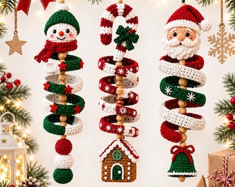 May include: Three hanging crochet Christmas ornaments featuring a snowman, a candy cane with a gingerbread house, and Santa Claus. Each ornament has a spiral design with red, white, and green yarn, wooden beads, and festive holiday motifs.