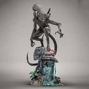 May include: A detailed statue of an Alien creature, posed atop a futuristic base with a cracked glass container. The Xenomorph is dark gray with a long head, sharp teeth, and a segmented tail. The base features mechanical details and green plant accents.