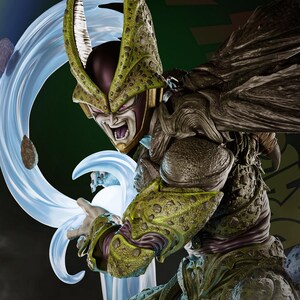 May include: A detailed figurine of a character with a green and brown exoskeleton, purple face, and yellow accents. The figure is in a dynamic pose, with a blue energy effect emanating from its hand. The background is a dark green.