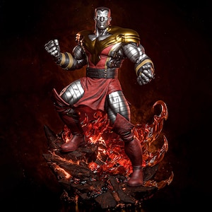 May include: A detailed statue of a superhero figure with a metallic silver body, red and gold accents, and a determined pose. The figure stands on a fiery, rocky base, with a dark background. The statue is a collectible item.