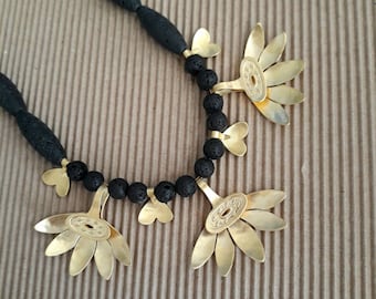 Gold Daisy Flower Necklace Black Lava Stones Unique Gift idea Handmade in Israel Nature Inspired Statement Stylish Jewelry Artisan Design