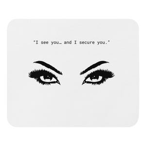 May include: White mousepad featuring a black and white illustration of two eyes with long eyelashes and arched eyebrows. The text above the eyes reads, "I see you... and I secure you."