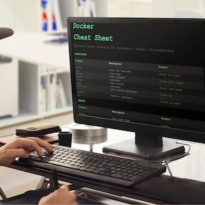 May include: A person wearing a cap and glasses is working on a computer. The screen shows a "Docker Cheat Sheet" with green text on a black background. The keyboard and mouse are in front of the screen. The text provides essential Docker reference for developers.