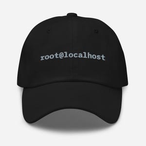 May include: Black baseball cap with the text "root@localhost" embroidered in light gray. The cap has a curved brim and a button on top. A casual accessory for everyday wear.