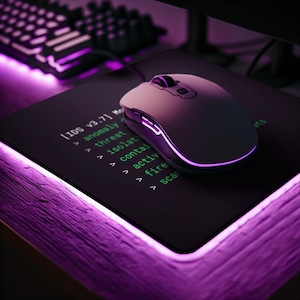 May include: A black computer mouse with purple accents sits on a black mousepad. The mousepad has green text and a purple border. A keyboard is visible in the background. The text on the mousepad reads "[IDS v3.7]" and lists several commands.