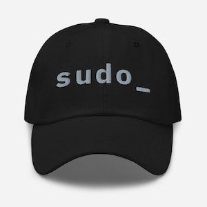 May include: Black baseball cap with the word "sudo_" embroidered in light blue thread. The cap has a curved brim and a six-panel design. A casual hat suitable for everyday wear.