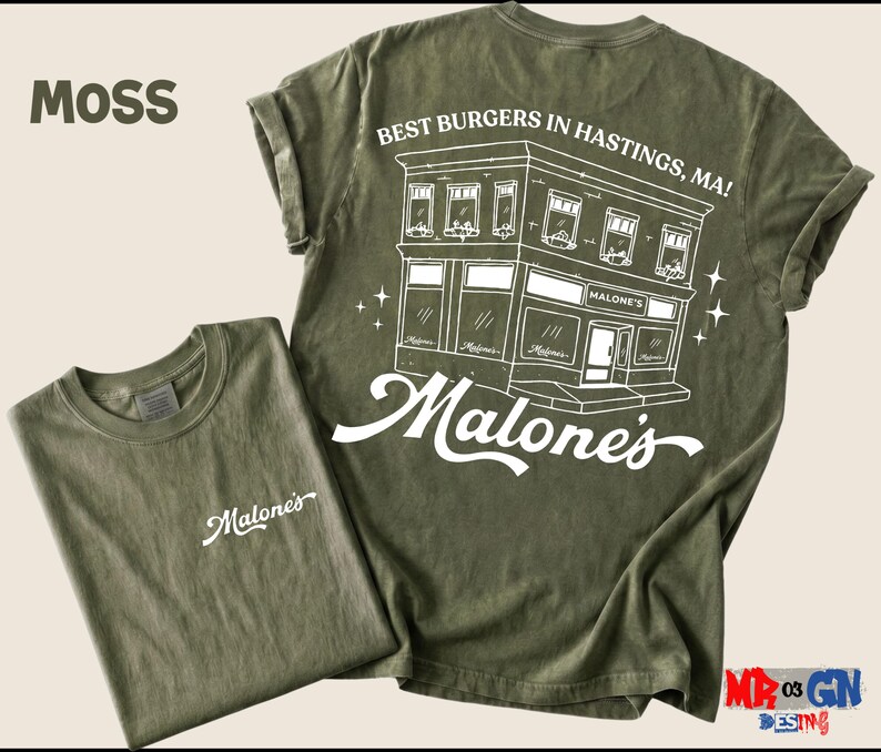 a green t-shirt with a graphic design of a building and the text "Malone's" printed on it.