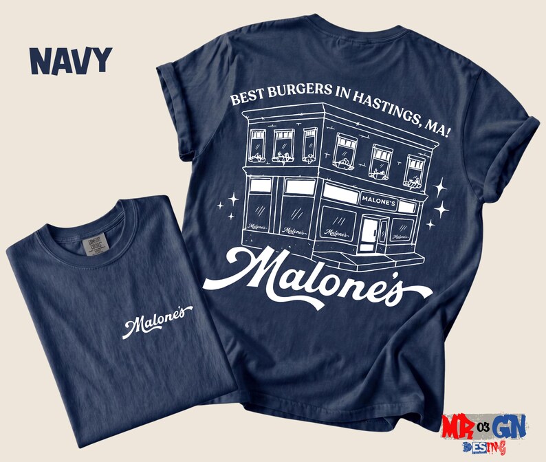 Navy t-shirt with a graphic design of a building and the text "Best Burgers in Hastings, MA!"