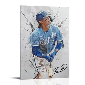 May include: A canvas print of a baseball player in a light blue Royals uniform, holding a bat. The image has a watercolor effect with paint splatters in the background. The player is wearing a helmet and gloves, with a signature in the bottom right corner.