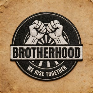 May include: A circular embroidered patch featuring a black background with two white fists raised in solidarity at the top. A horizontal white banner across the center displays the word BROTHERHOOD in black, with the text WE RISE TOGETHER below.