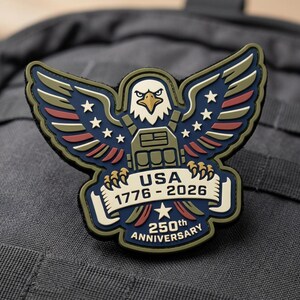 May include: A patriotic patch featuring a stylized eagle with outstretched wings, stars, and stripes in red, white, blue, and olive green. The patch reads "USA 1776-2026 250th Anniversary."