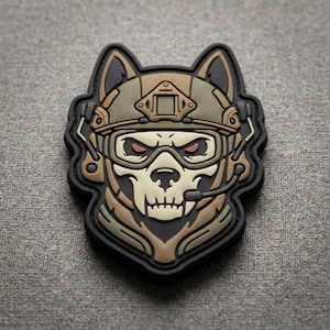 May include: A tactical morale patch featuring a stylized wolf skull wearing a combat helmet with a mounted night vision shroud, protective goggles with red lenses, and a communication headset with a microphone boom, rendered in olive and tan.