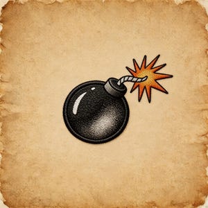 May include: An embroidered patch featuring a round black bomb with a white highlight, a grey fuse, and a bright orange and yellow star-shaped explosion. The design is rendered with detailed stitching and a circular border on a textured background.