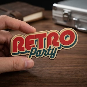 May include: A retro-themed sticker with the words "RETRO Party" in a bold, stylized font. The text is primarily red with a cream-colored outline and a teal accent. The sticker is held in a hand.