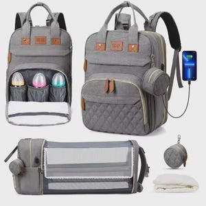 May include: Gray diaper bag backpack with multiple compartments, including insulated bottle pockets and a changing pad. Features a quilted front pocket, a small round pouch, and a built-in USB charging port. Includes a portable bassinet.