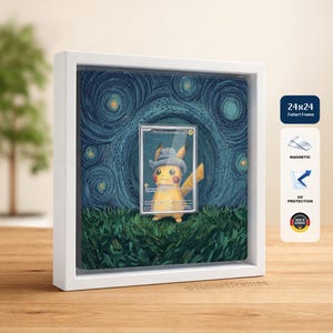 May include: A square white frame containing a trading card of a yellow Pikachu wearing a grey hat, set against a dark blue swirling starry background and green grass. The frame features magnetic closure, UV protection, and a 24x24 size label.