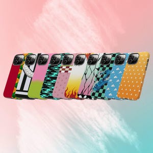 May include: A collection of colorful phone cases with various designs. The cases feature patterns like stripes, flames, and geometric shapes in red, white, pink, green, and yellow. The cases are designed to fit a smartphone.