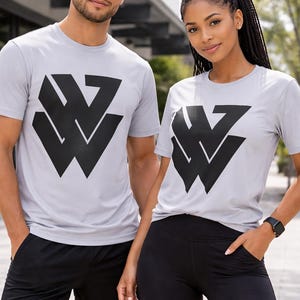 May include: A handmade, wooden serving tray with a natural finish. The tray features a rectangular shape with rounded corners and raised edges. It is ideal for serving food or displaying decorative items. Measures 12 inches long, 8 inches wide, and 2 inches high.