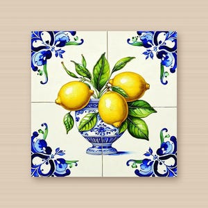 May include: A square ceramic tile mural featuring a central blue and white pedestal bowl filled with three bright yellow lemons and green leaves. The corners of the mural are decorated with blue floral scrollwork patterns on a white background.