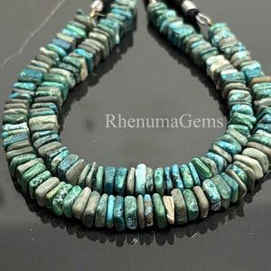 May include: Two strands of turquoise and green gemstone beads. The beads are rectangular and have a natural, earthy appearance. The image includes the text "RhenumaGems".