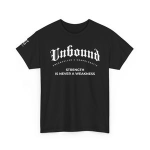 May include: Black t-shirt with the word "Unbound" in a gothic font. Below the word "Unbound" are the words "Uncancelled & Unapologetic" and "Strength is Never a Weakness" in white text.