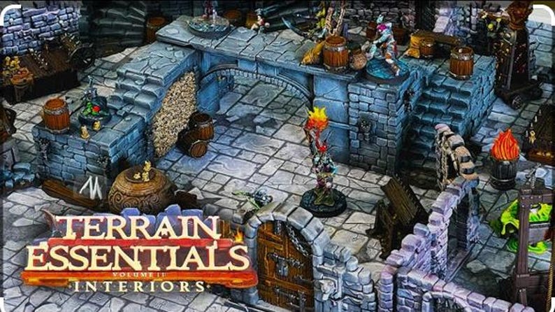 Op de afbeelding: Een gedetailleerde miniatuur kerkerterreinset met stenen muren, bogen en trappen. De set bevat vaten, fakkels en figuren, met de tekst "TERRAIN ESSENTIALS VOLUME II INTERIORS" onderaan. Ideaal voor tabletop gaming.