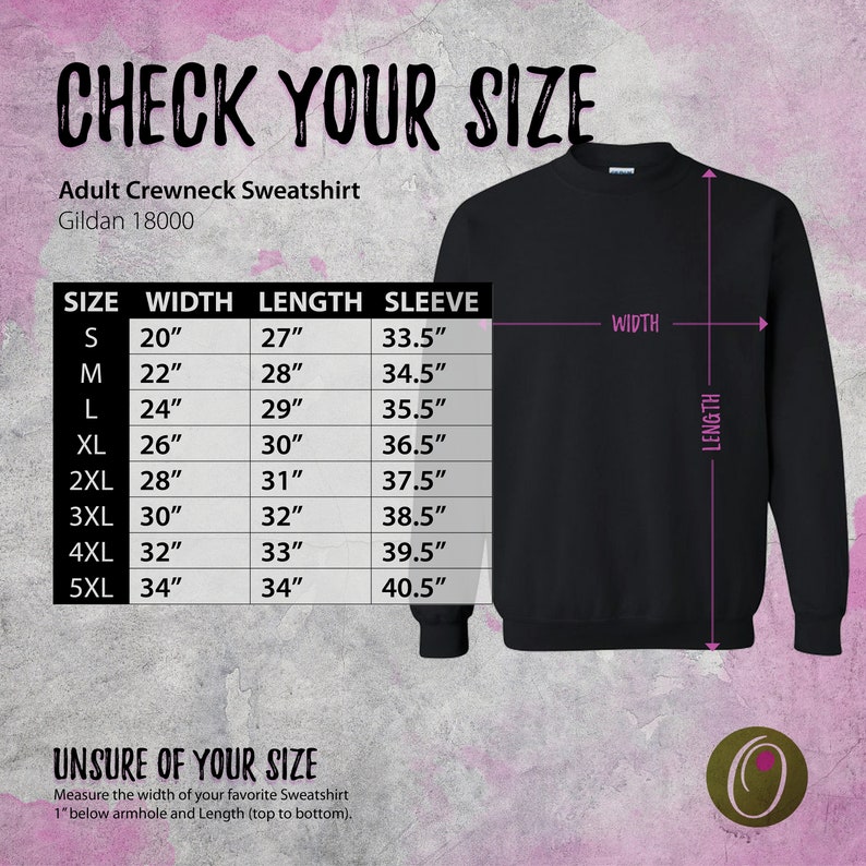 May include: Size chart for an adult crewneck sweatshirt. The chart shows the size, width, length, and sleeve length in inches. The chart is on a pink background with a black sweatshirt in the background.