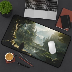 May include: A black mousepad with a fantasy landscape design. The image features a green forest, a river, a stone bridge, and a tall, stone building in the background. The mousepad is perfect for gamers and anyone who wants to add a touch of fantasy to their workspace.